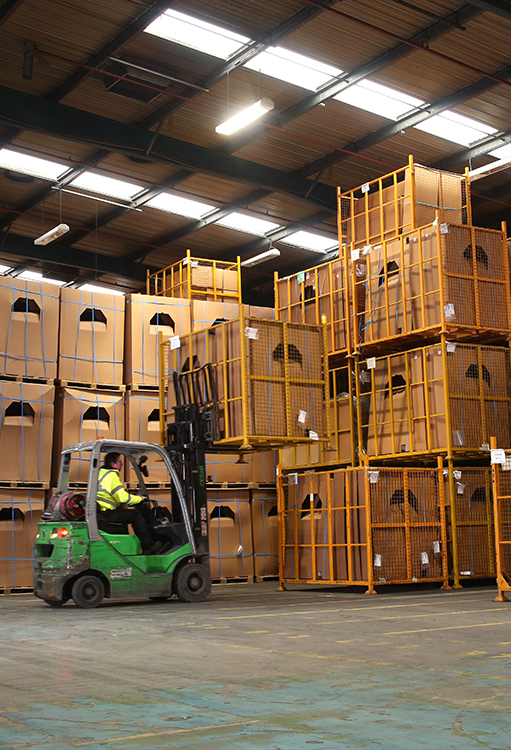 man working in pallet delivery service in warehouse in leicester