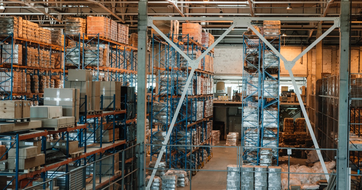 modern-warehouse-interior-with-boxes-and-container | management systems